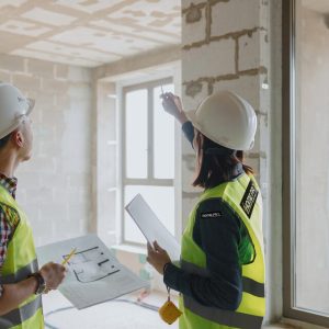 20230707235511__two-engineers-man-woman-white-helmets-green-protective-vests_423170-852_large